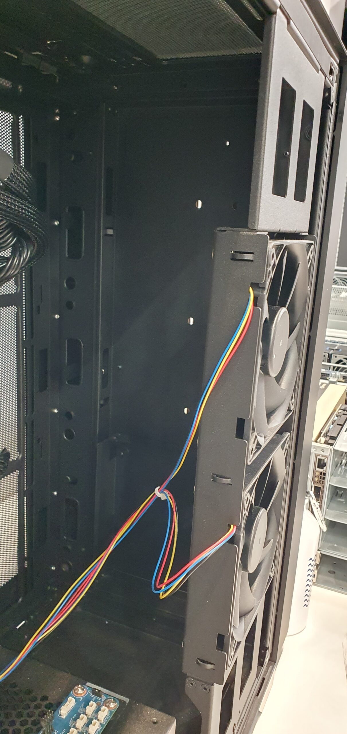 Interior of a workstation chassis showing case cooling fans and wiring — Gigabyte W775-V10-L01 NVIDIA DGX Station GB300
