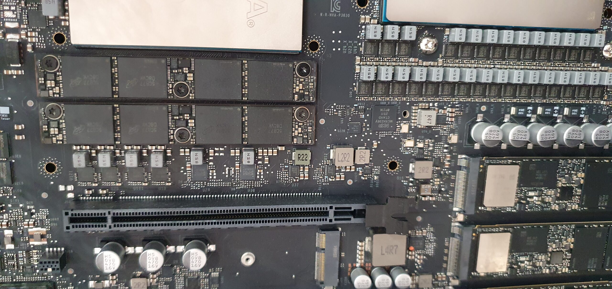 Close-up of a workstation motherboard showing memory slots, capacitors, and surface-mount components — Gigabyte W775-V10-L01 NVIDIA DGX Station GB300