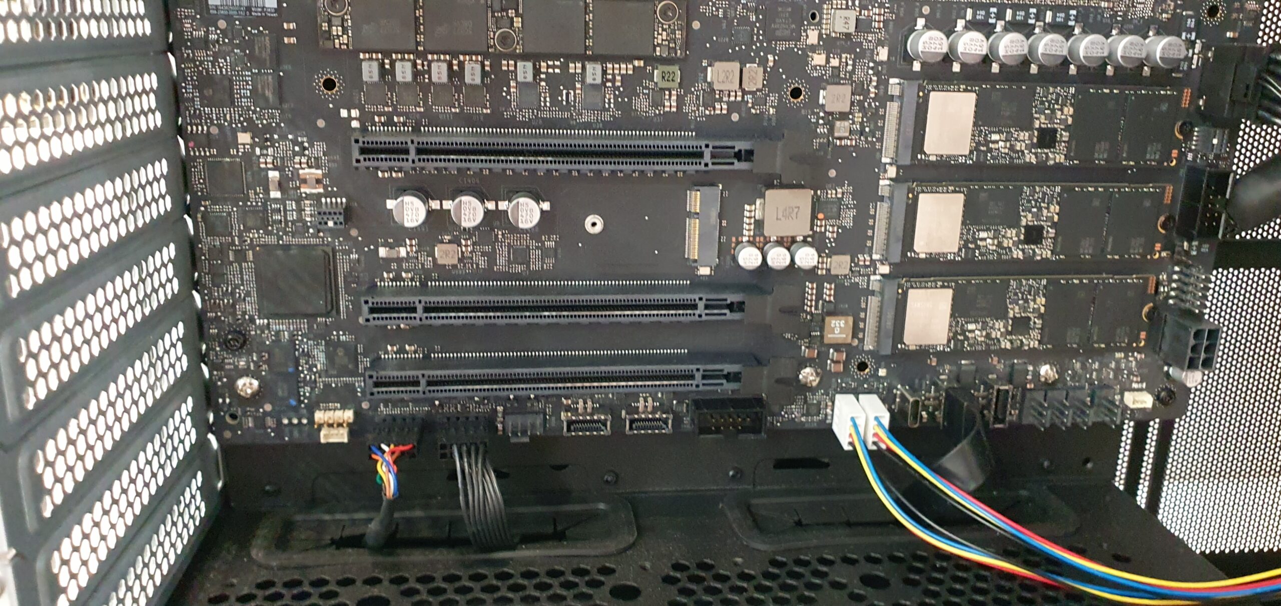 Close-up of a workstation motherboard showing PCIe expansion slots and internal wiring — Gigabyte W775-V10-L01 NVIDIA DGX Station GB300