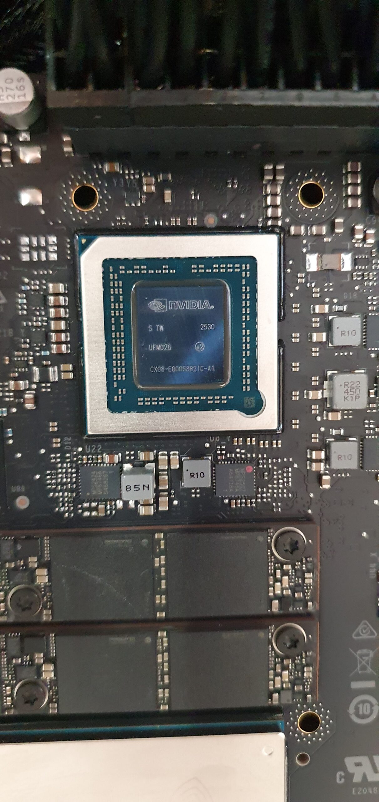 Close-up of an NVIDIA chip mounted on a circuit board with surrounding components — Gigabyte W775-V10-L01 NVIDIA DGX Station GB300
