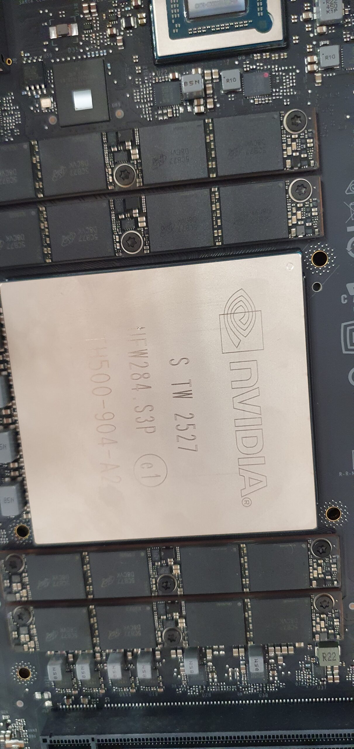 Close-up of an NVIDIA GPU die surrounded by memory modules on a circuit board — Gigabyte W775-V10-L01 NVIDIA DGX Station GB300