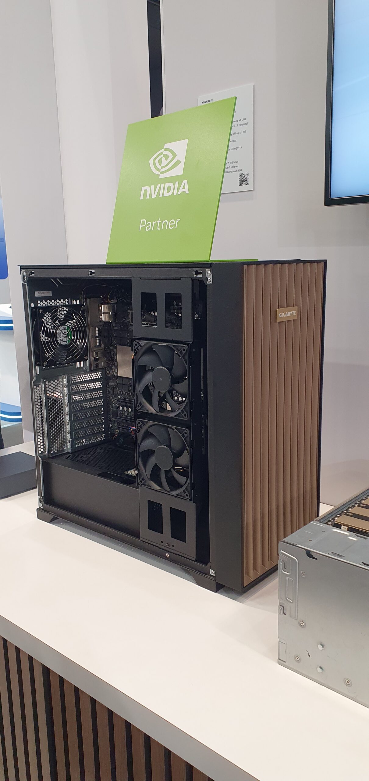 Open tower workstation chassis with cooling fans on display, topped with an NVIDIA Partner sign — Gigabyte W775-V10-L01 NVIDIA DGX Station GB300