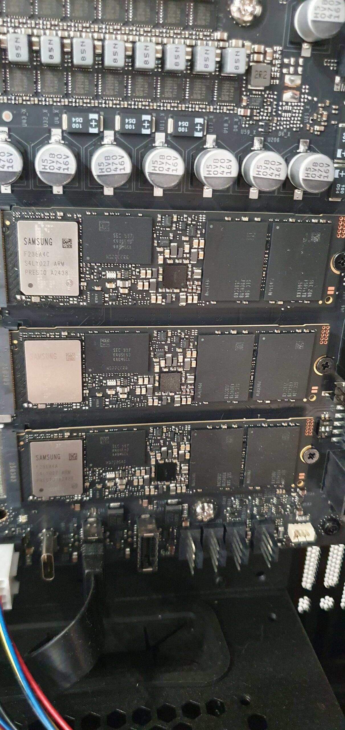 Close-up of three Samsung M.2 NVMe SSD modules mounted on a workstation motherboard — Gigabyte W775-V10-L01 NVIDIA DGX Station GB300