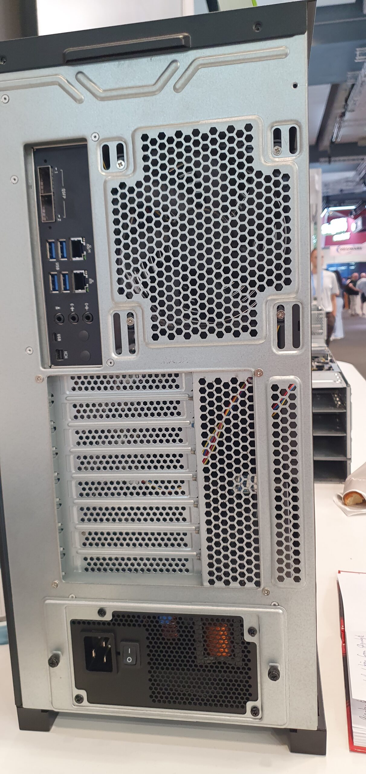 Rear panel of a tower workstation showing USB and network ports, expansion slots, and power supply — Gigabyte W775-V10-L01 NVIDIA DGX Station GB300