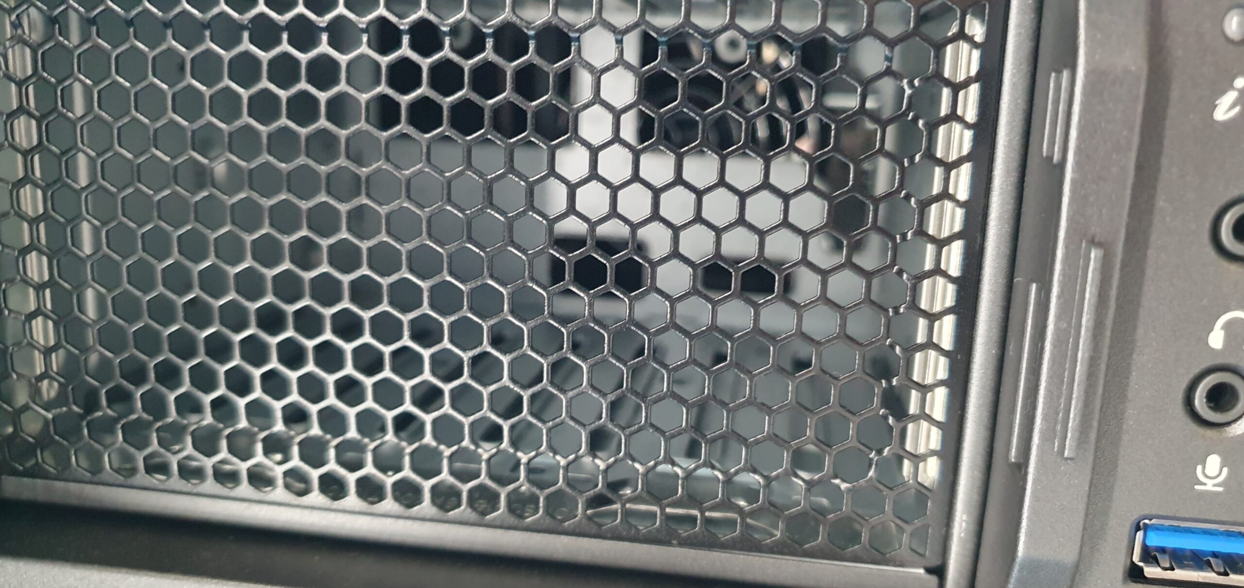 Close-up of a honeycomb mesh ventilation panel on a computer chassis — Supermicro ARS-511GD-NB-LCC NVIDIA DGX Station GB300