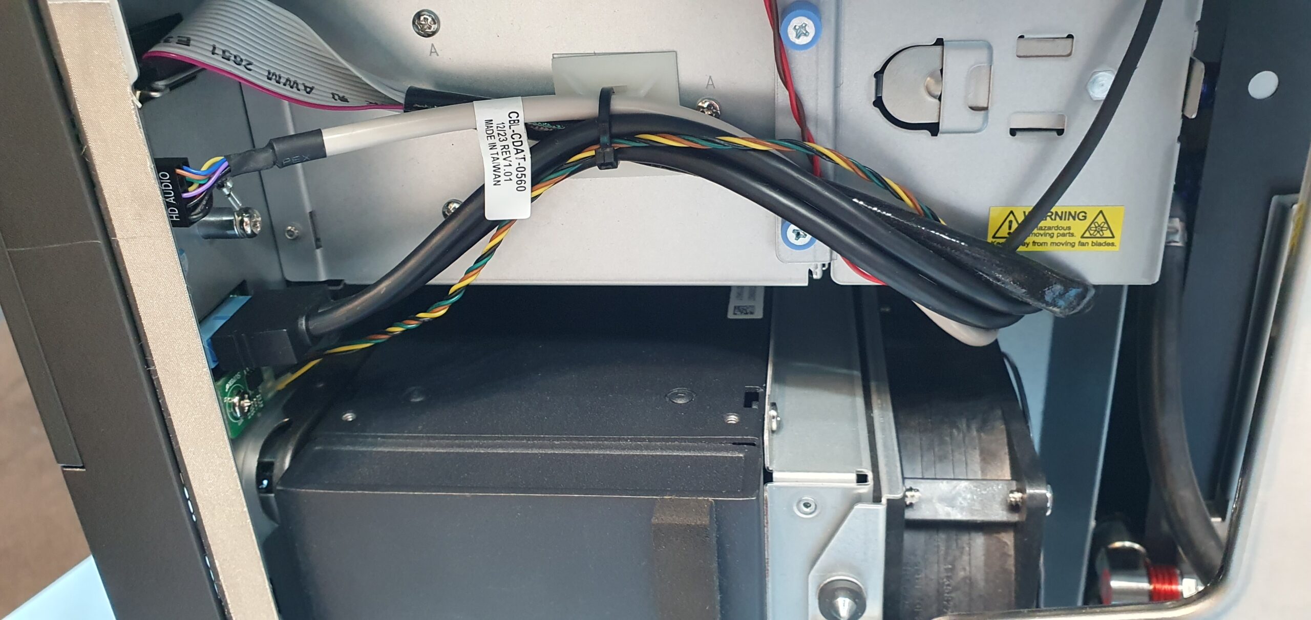 Internal workstation chassis view showing ribbon and power cables routed to a fan module — Supermicro ARS-511GD-NB-LCC NVIDIA DGX Station GB300