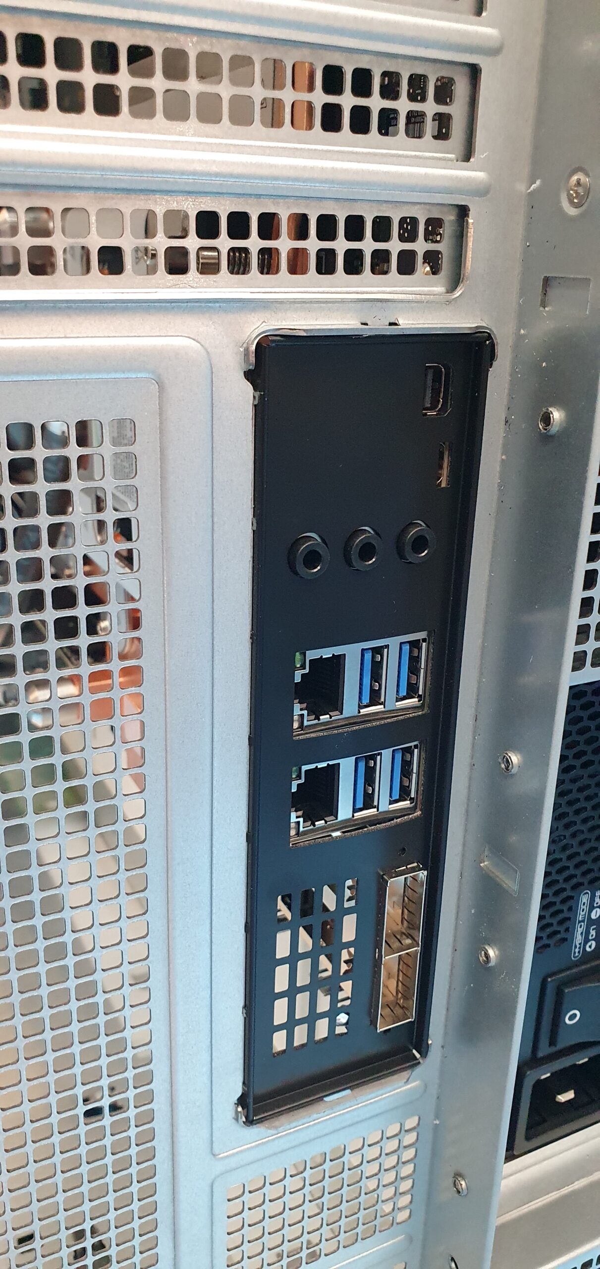 Close-up of a workstation rear I/O panel with dual Ethernet ports, USB ports, audio jacks and mini DisplayPort output — Supermicro ARS-511GD-NB-LCC NVIDIA DGX Station GB300