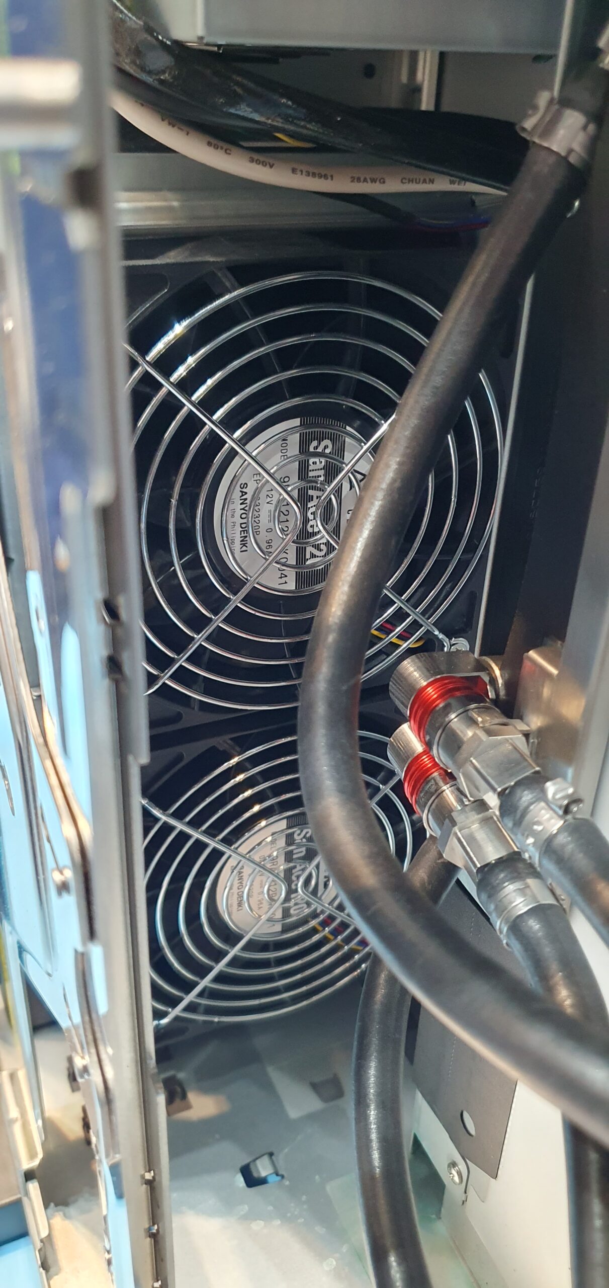 Interior view of a workstation chassis showing dual cooling fans and liquid cooling tubing — Supermicro ARS-511GD-NB-LCC NVIDIA DGX Station GB300