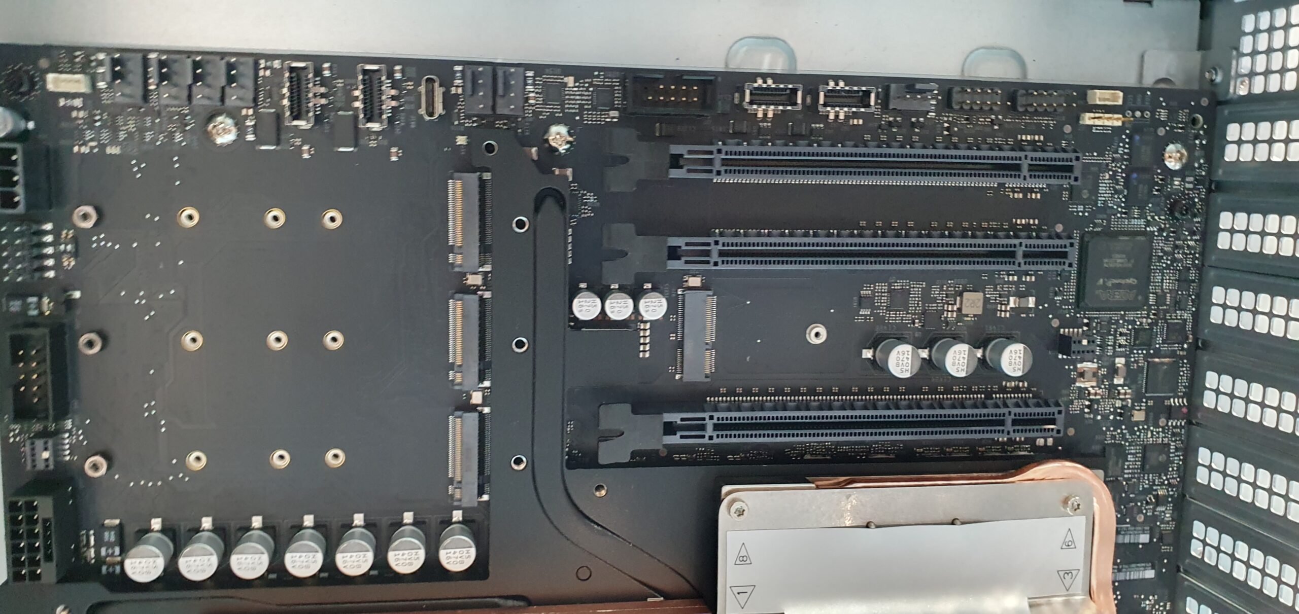 Top-down view of a workstation motherboard showing PCIe expansion slots, M.2 connectors, and capacitors — Supermicro ARS-511GD-NB-LCC NVIDIA DGX Station GB300