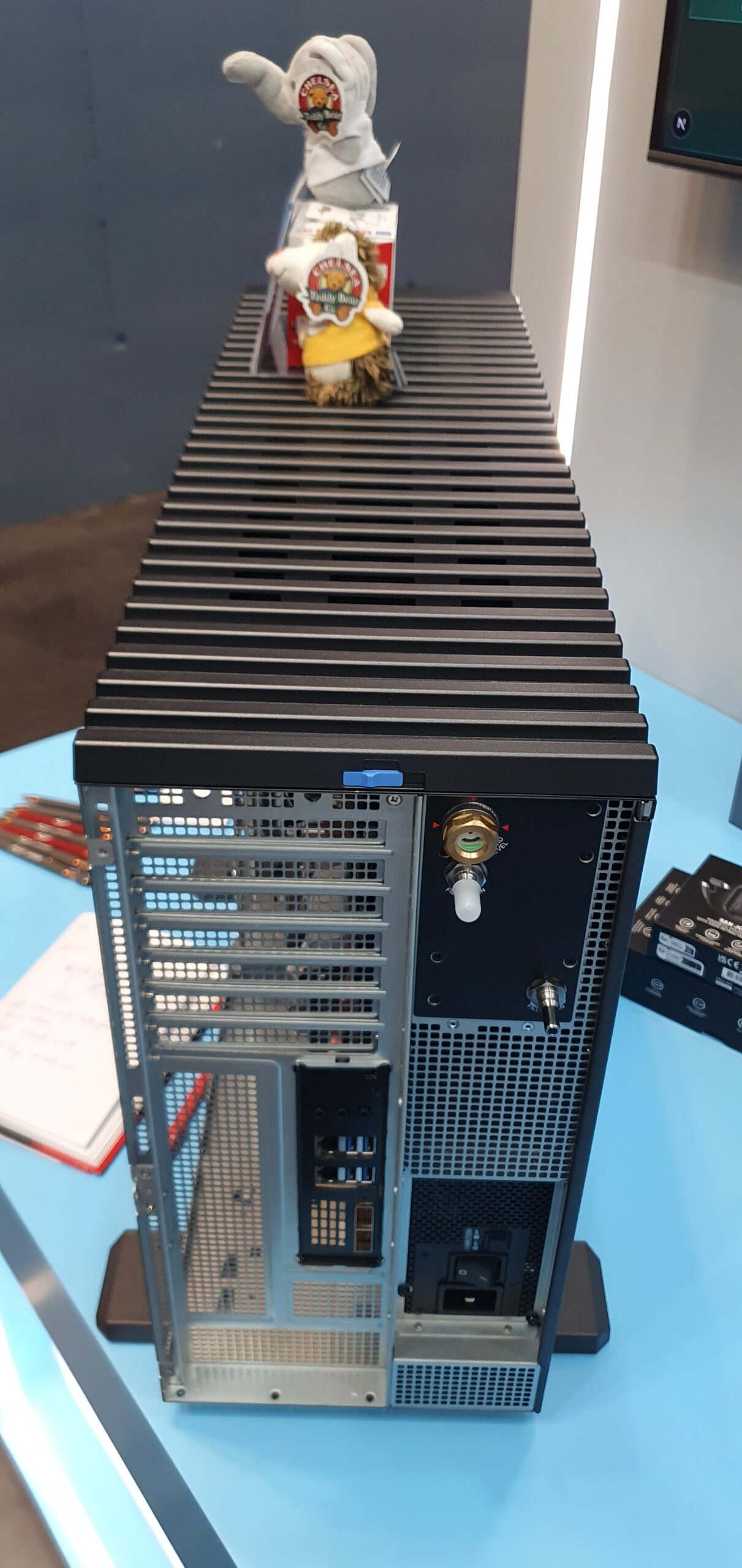 Rear view of a tower workstation chassis with large heatsink fins on top and expansion slots and connectors on back — Supermicro ARS-511GD-NB-LCC NVIDIA DGX Station GB300